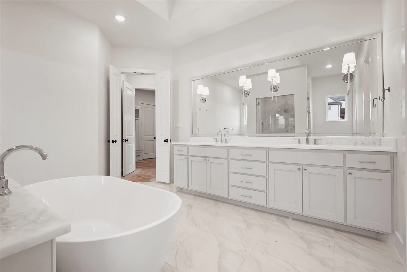 Contemporary Bathroom Remodel With Freestanding Tub And Double Vanity