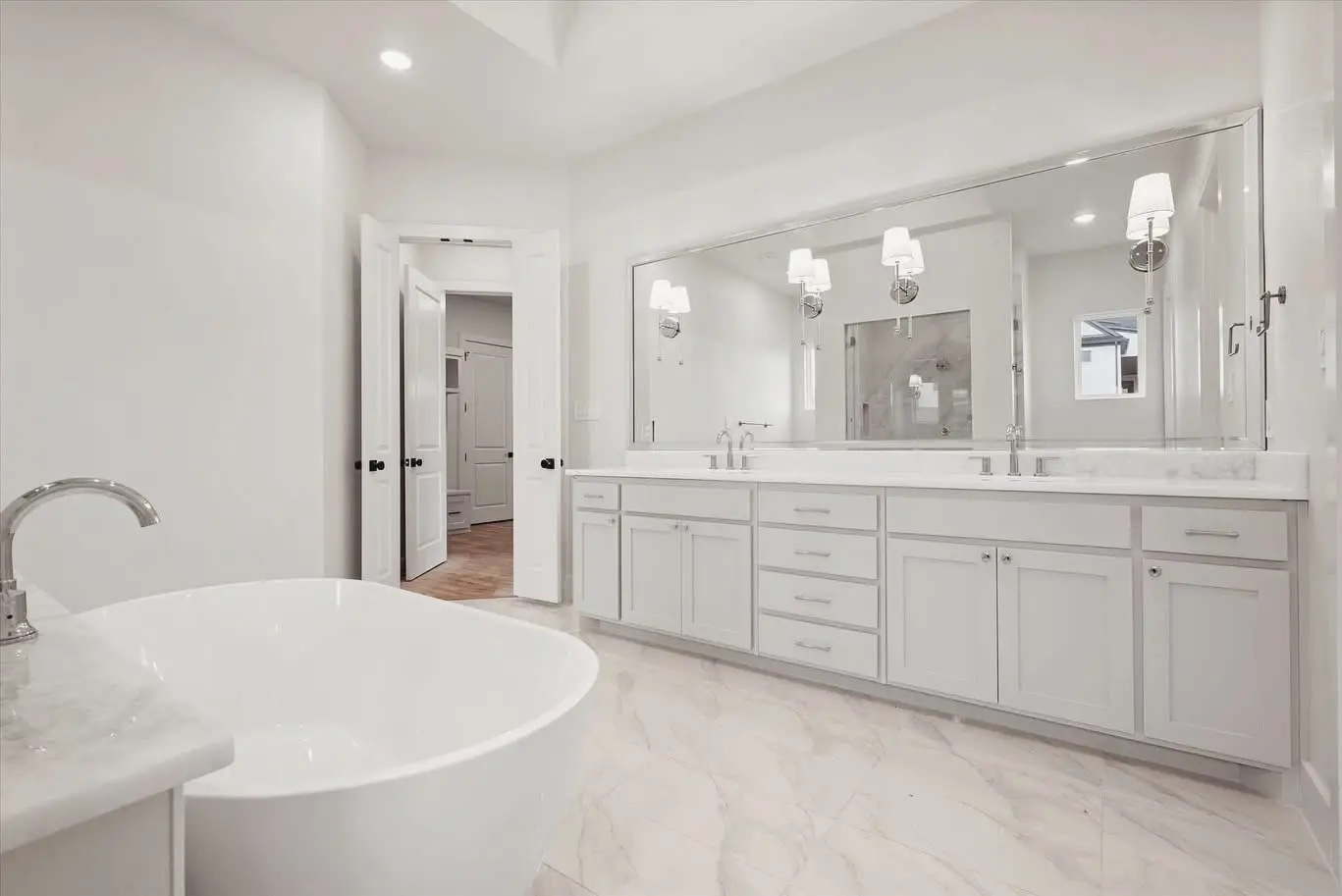 Contemporary Bathroom Remodel With Freestanding Tub And Double Vanity