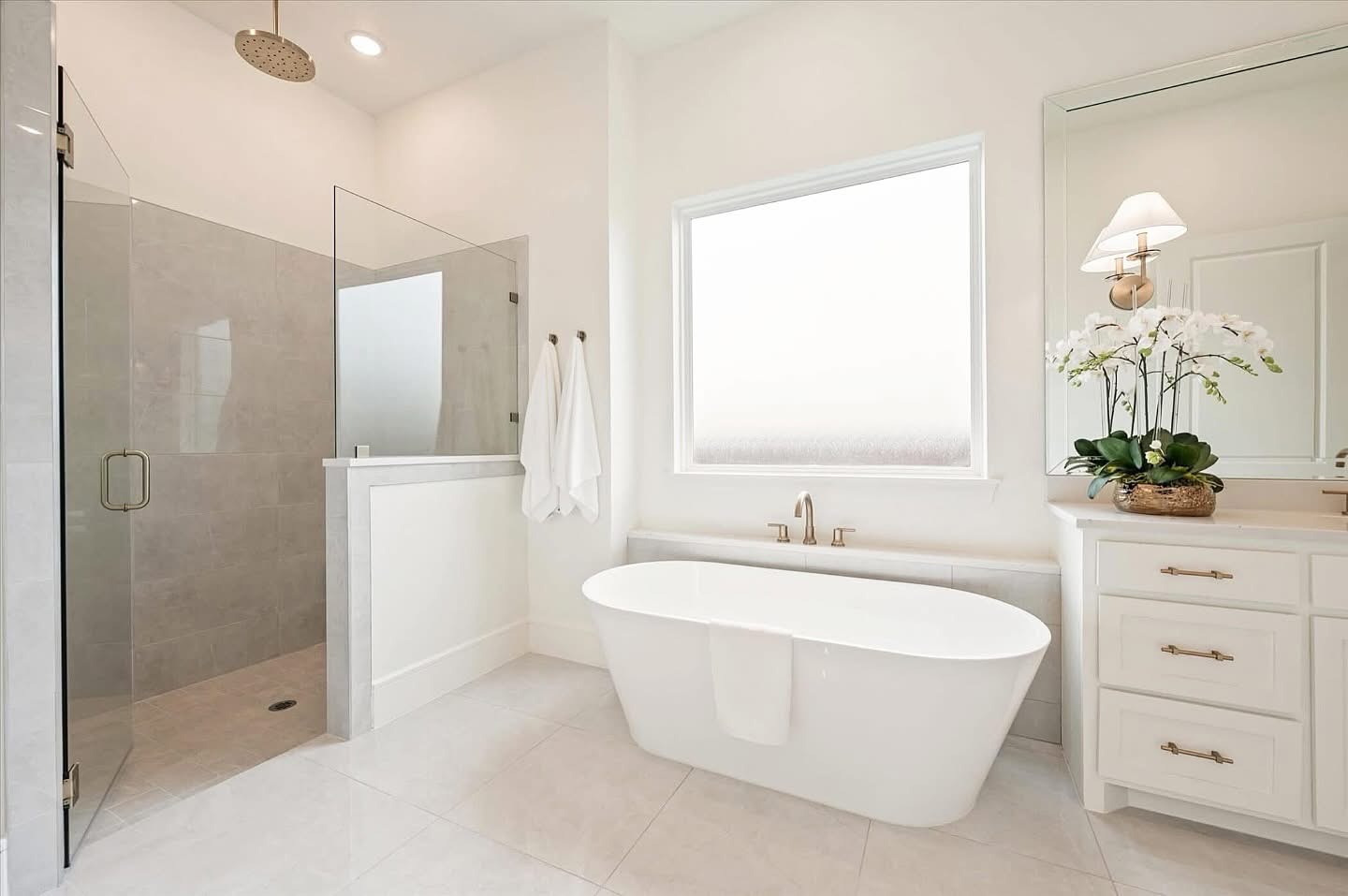Luxury Bathroom Remodel Featuring Freestanding Tub And Glass Shower
