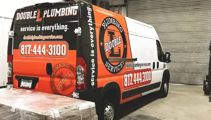 Double L Plumbing Truck In Garage