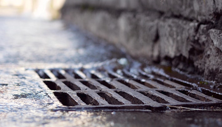 Rain water falling into sewerage drainage system